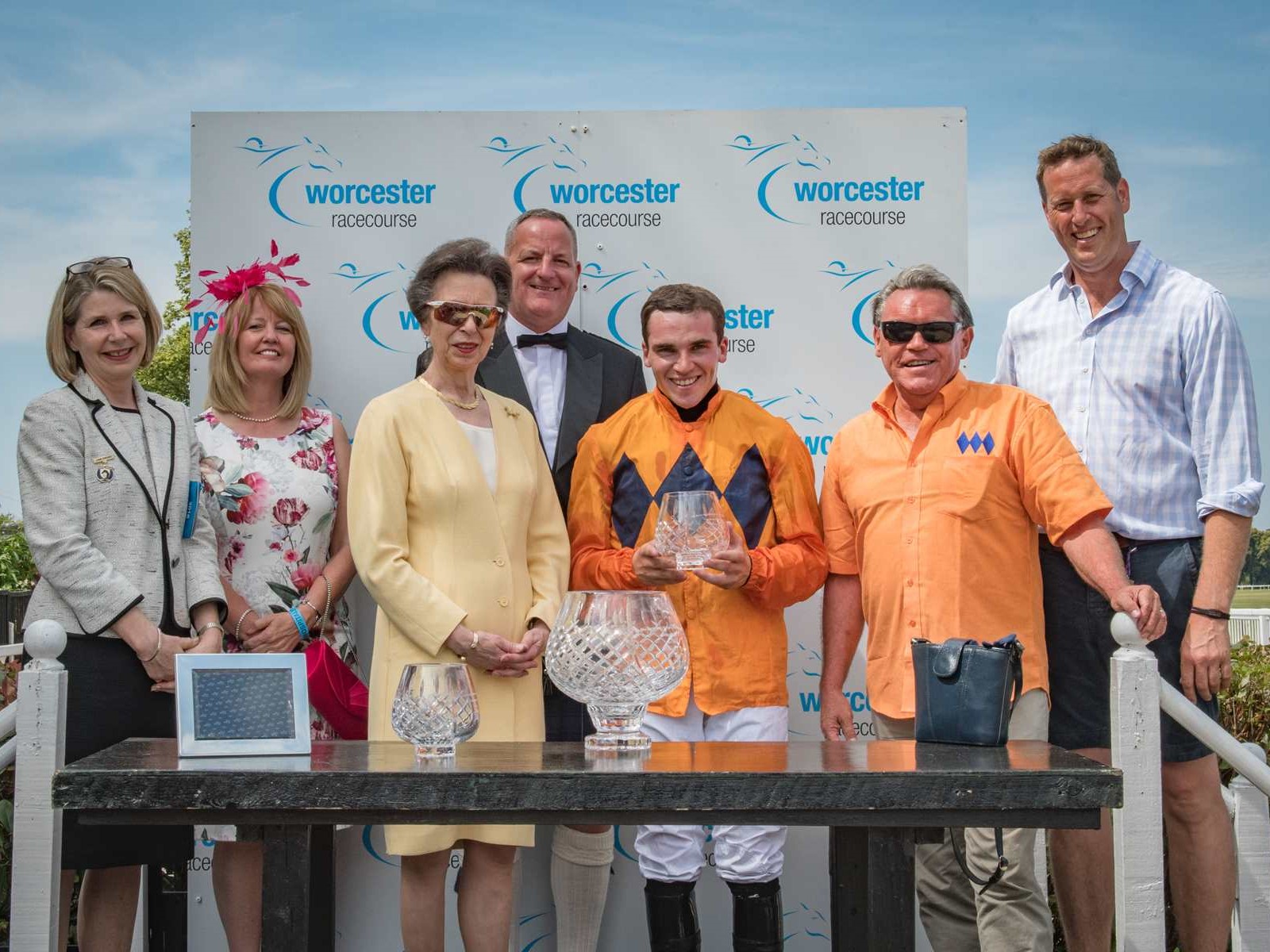 Jonathan Burke, Robert Aplin and Charlie Longsdon collecting the prize from Princess Anne after Bestwork's win of the Arctic Spas Worcester Grand Annual Handicap Chase